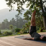 Best yoga retreat in Rishikesh featuring a serene yoga practice surrounded by nature's tranquility.